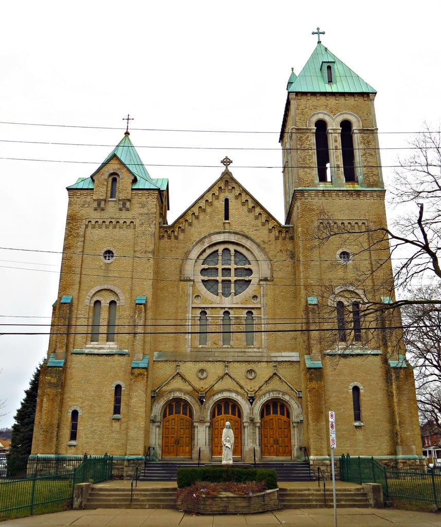 The twin copper-roofed towers and rose window of St. Ann's Church, Hamilton