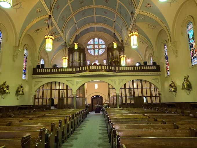 The nave of St. Ann's looking toward the gallery, with pipe chambers either side of the rose window